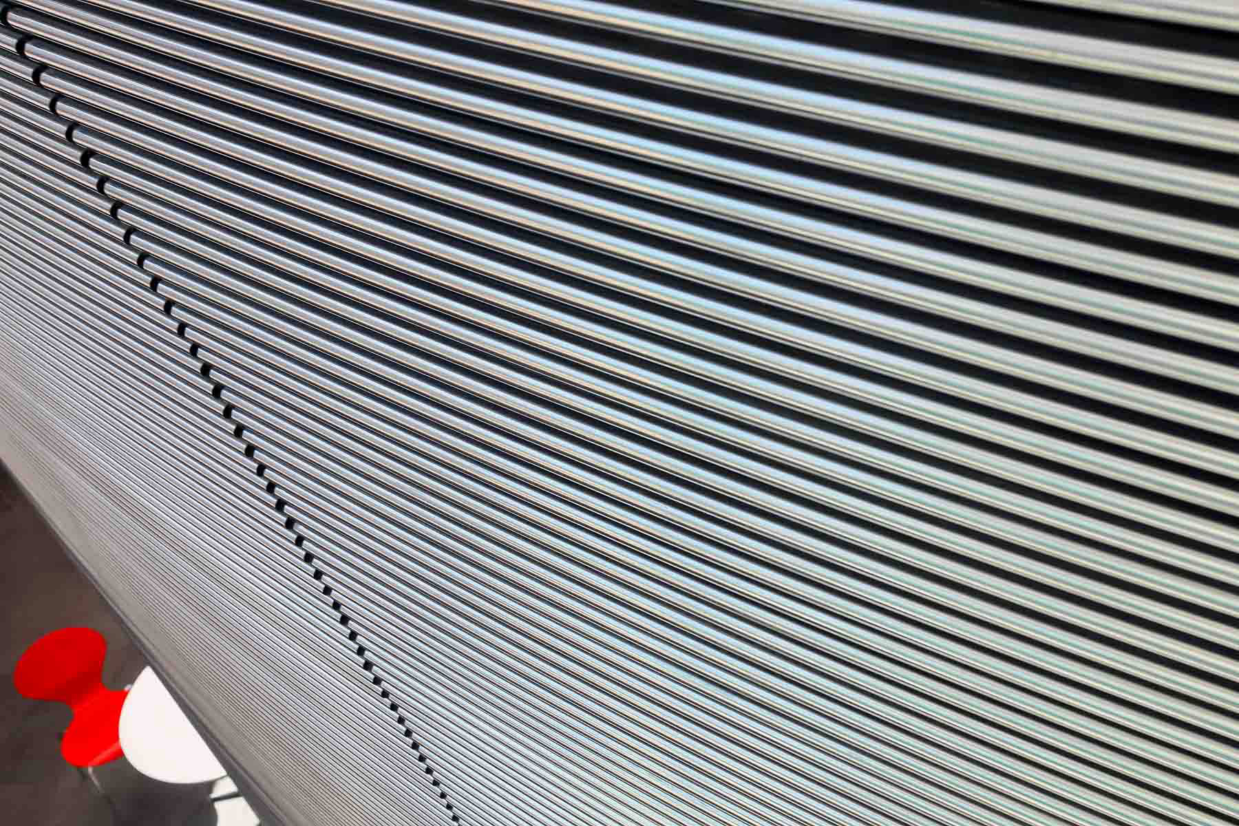 Extruded metal covering